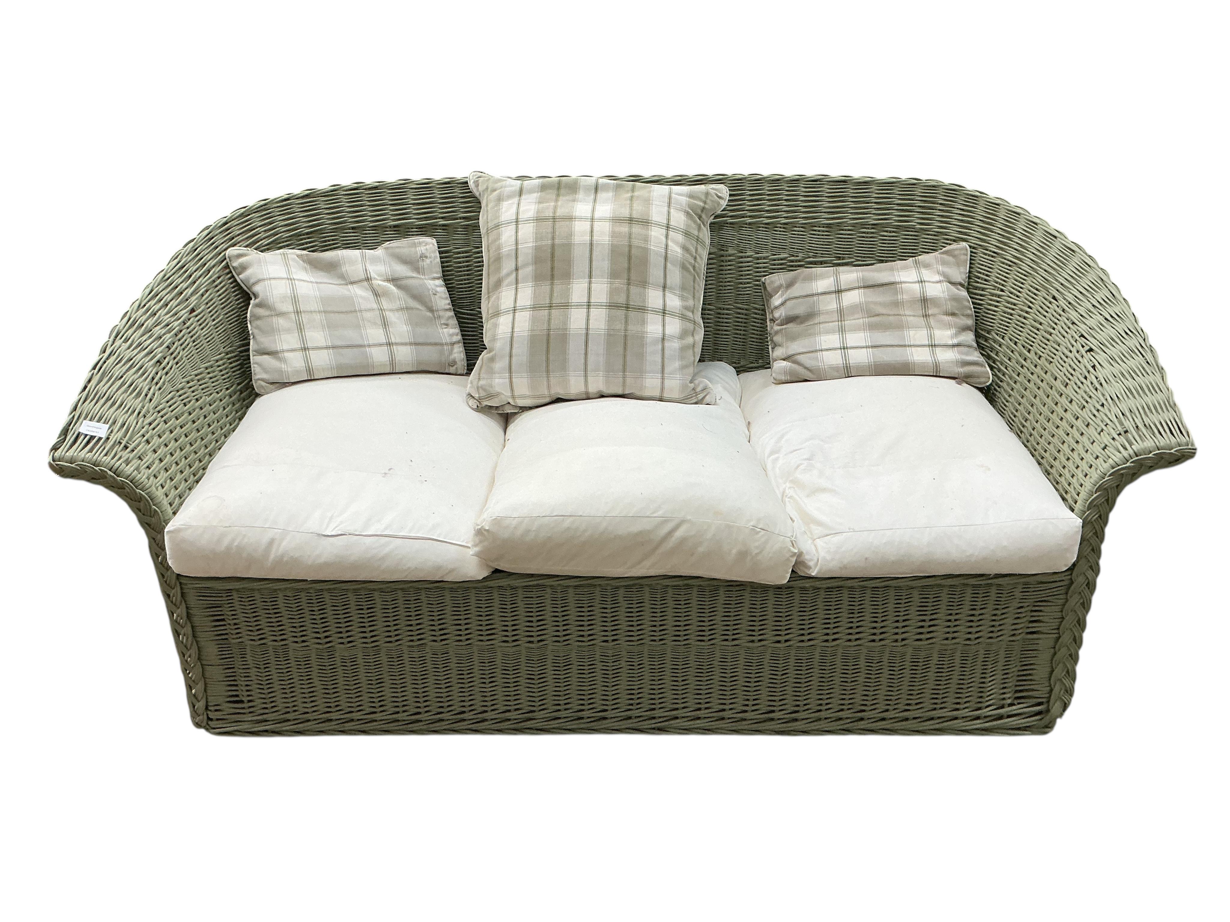 A Contemporary green wicker conservatory suite, comprising three seater settee, armchair, footstool and tray top table